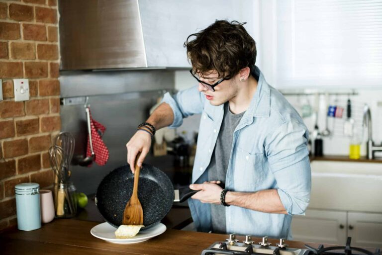 Caucasian man cooking in the kitchen